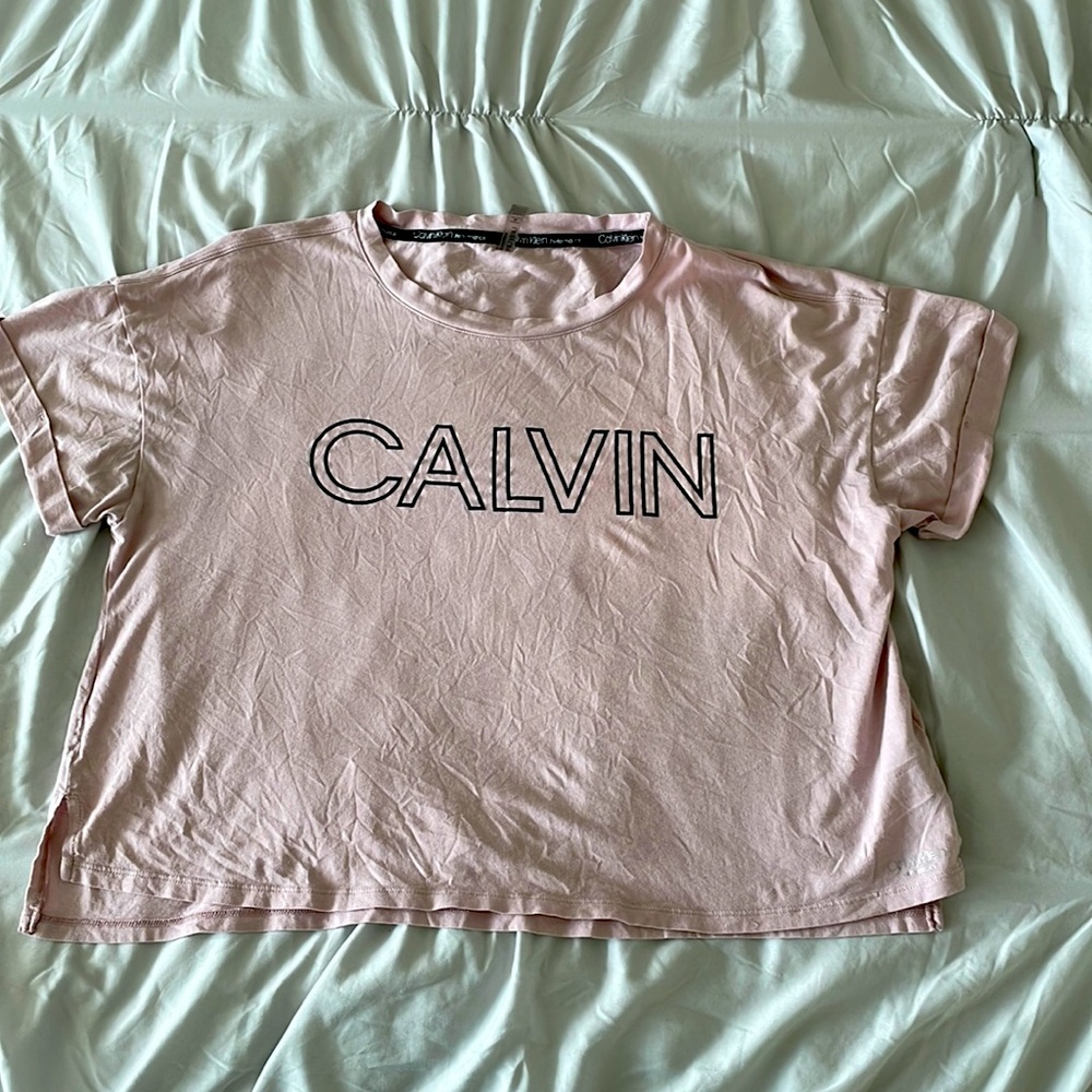 Pink Calvin Klein Performance shirt.
